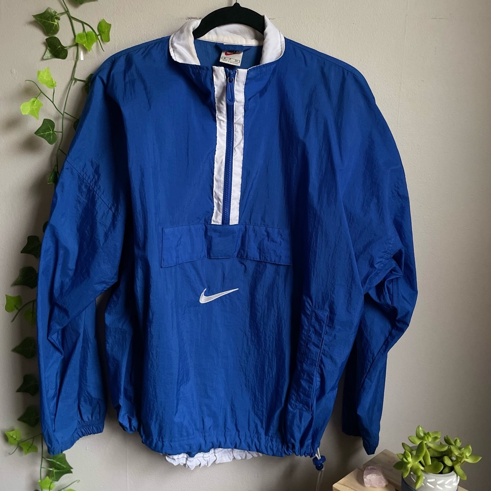 Used vintage blue and white Nike windbreaker/rain coat